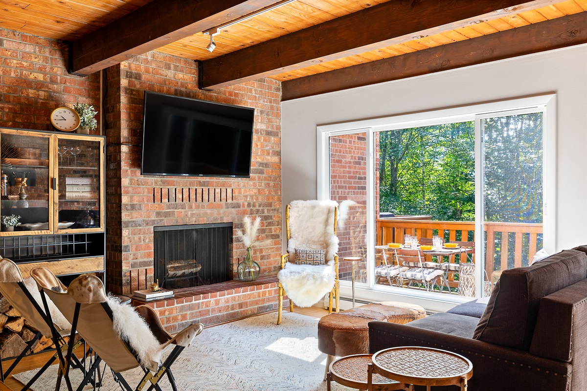 Large windows to soak in nature and relax on the deck during the spring/summer/fall.