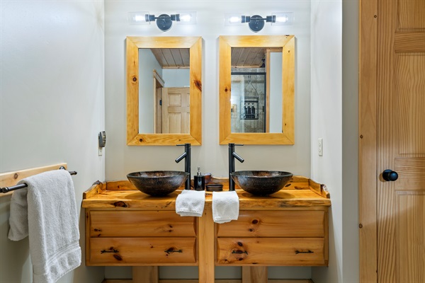 This spacious bathroom includes two vanities and dual sinks for added convenience