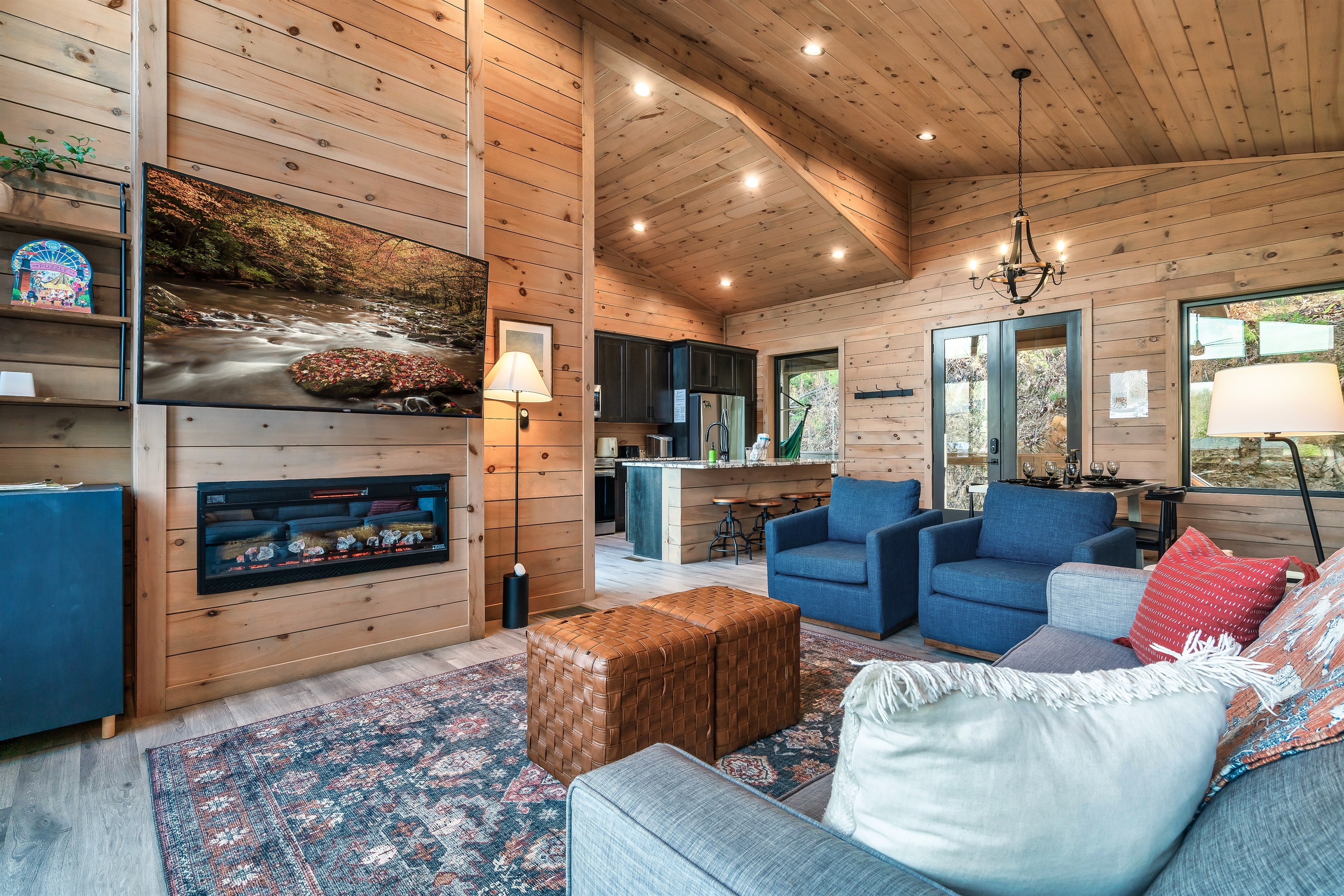 Spacious open-concept living room upstairs with a queen-size sleeper sofa