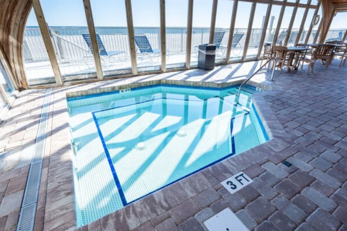 Indoor hot tub with an ocean view. 