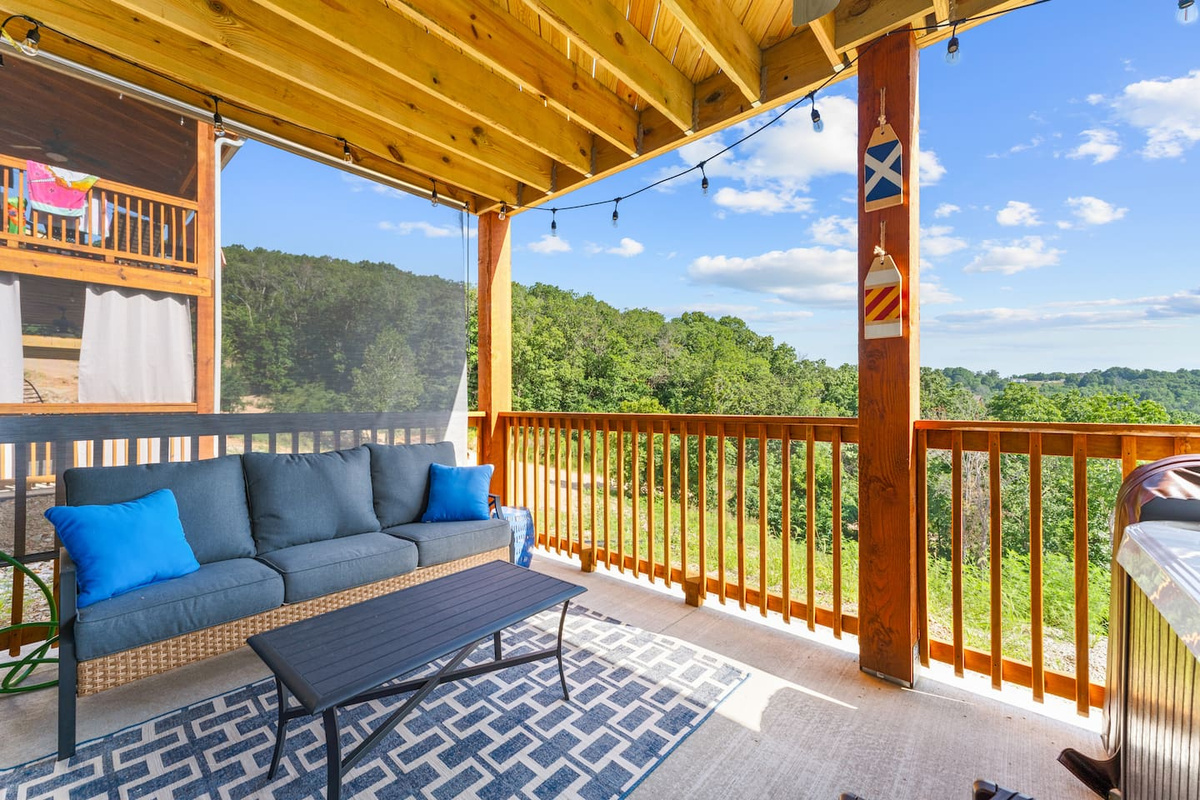 Relax on the covered deck overlooking the beautiful Ozark scenery