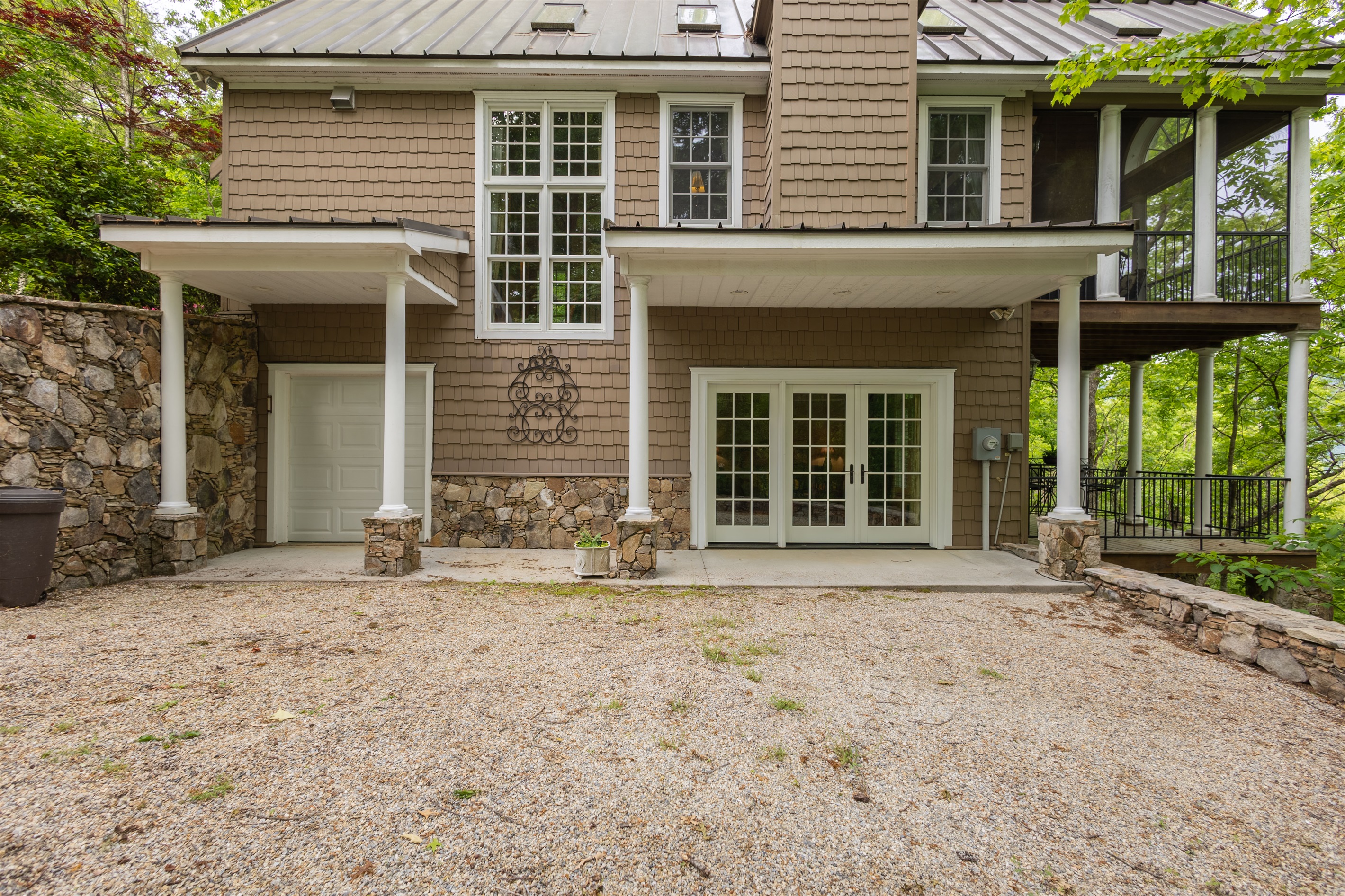 The lower level of the home offers private exterior access, covered parking space, and easy entry into the guest suite area.