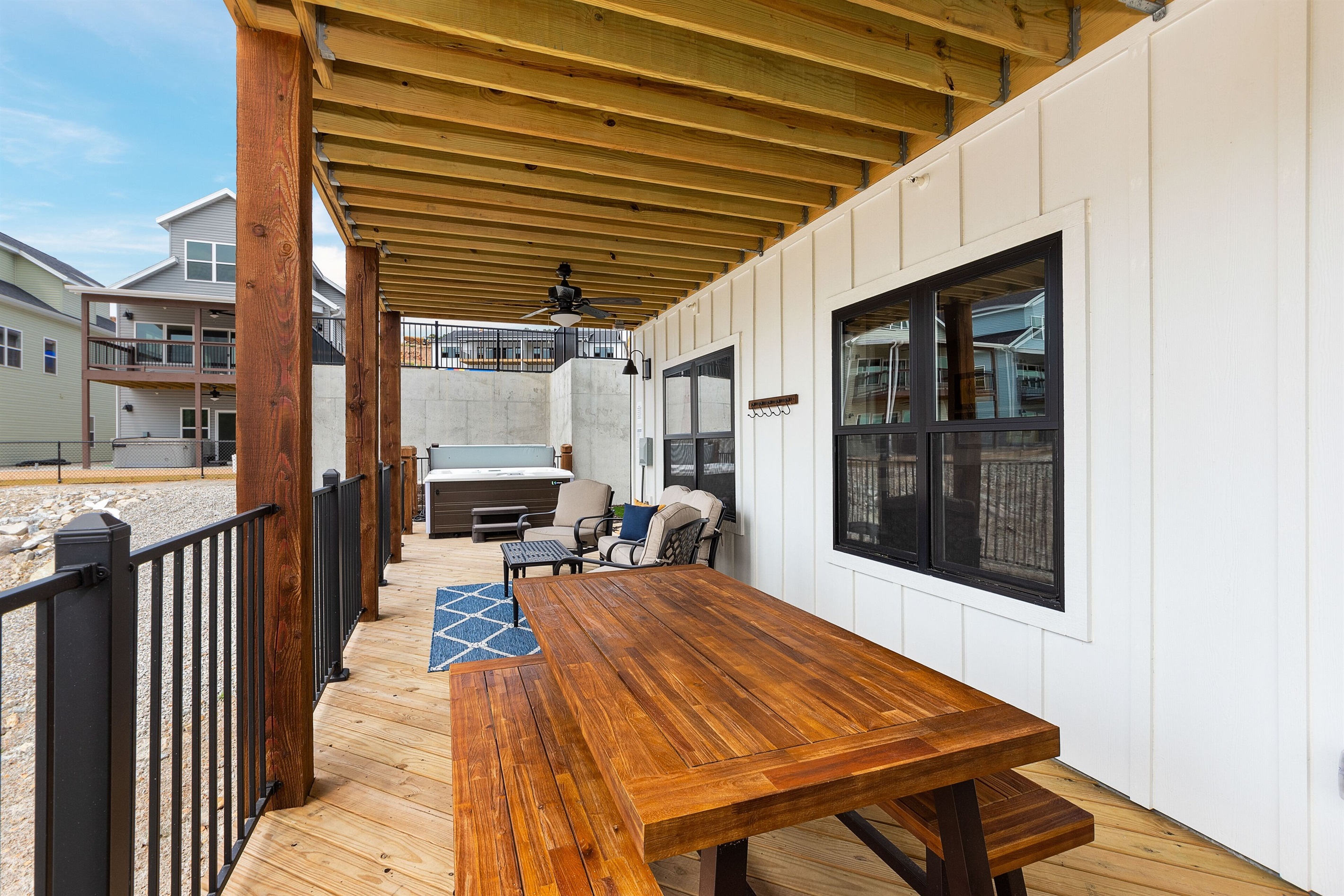 Lower Level Deck w/plenty of seating and 7 person hot tub