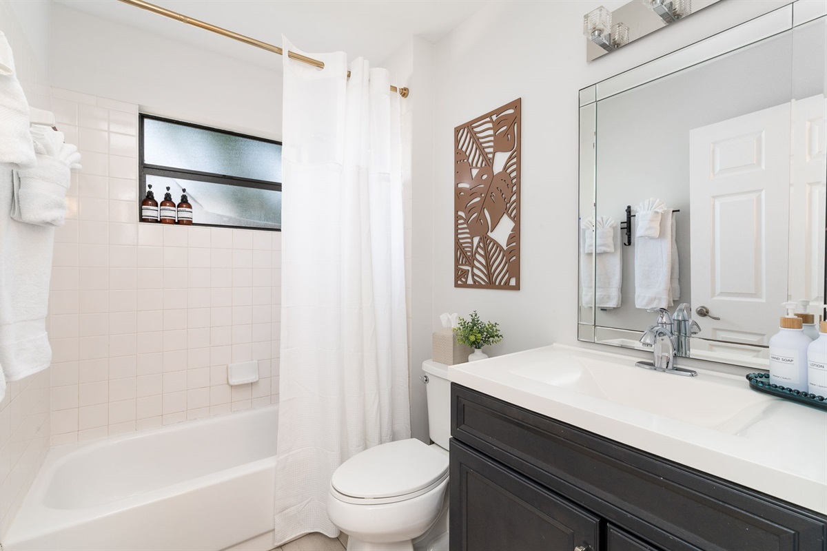 Fresh and guest-ready&mdash;bathroom comes fully stocked with soaps and toiletries.