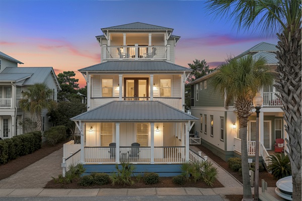 Bright 3-story home with separate carriage house, multiple porches and walkable access to the beach, pool, green space, restaurants and shops.