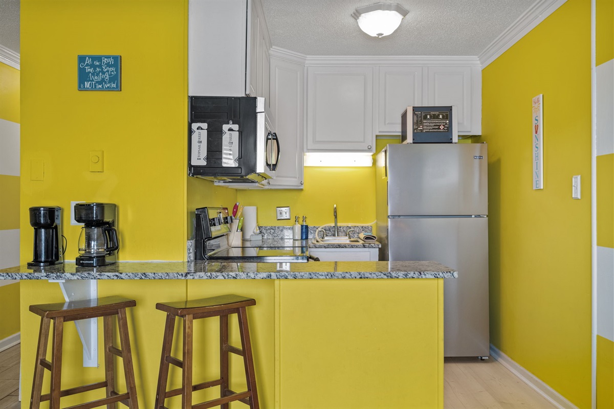 Cozy kitchen and bar area designed for casual dining, morning coffee, or evening drinks