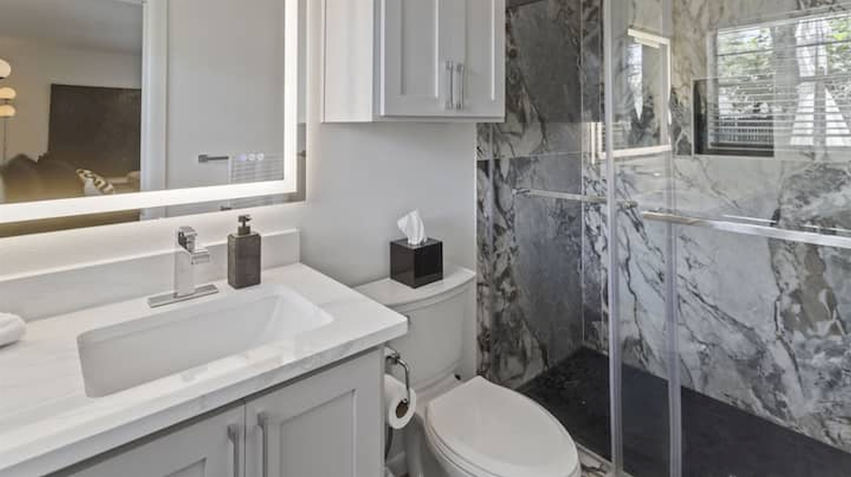 Walk-in shower with sleek finishes and a fresh spa-inspired feel.