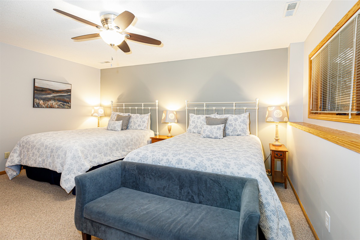 Bedroom #3 features two queen beds and an ensuite bathroom