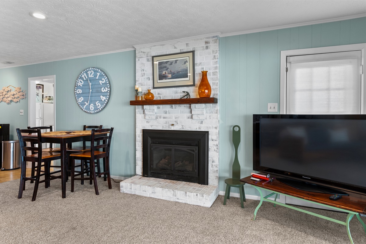 Living Room: Relax by the stylish fireplace, enjoying vibrant decor and great conversation!