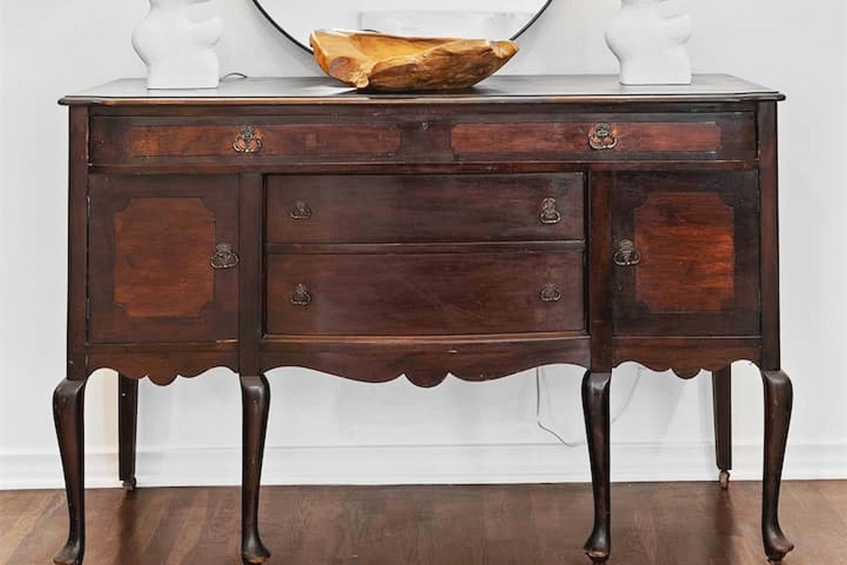 Thoughtfully styled accent space featuring warm wood tones, elegant lighting, and curated décor that adds charm and character throughout the home. ✨