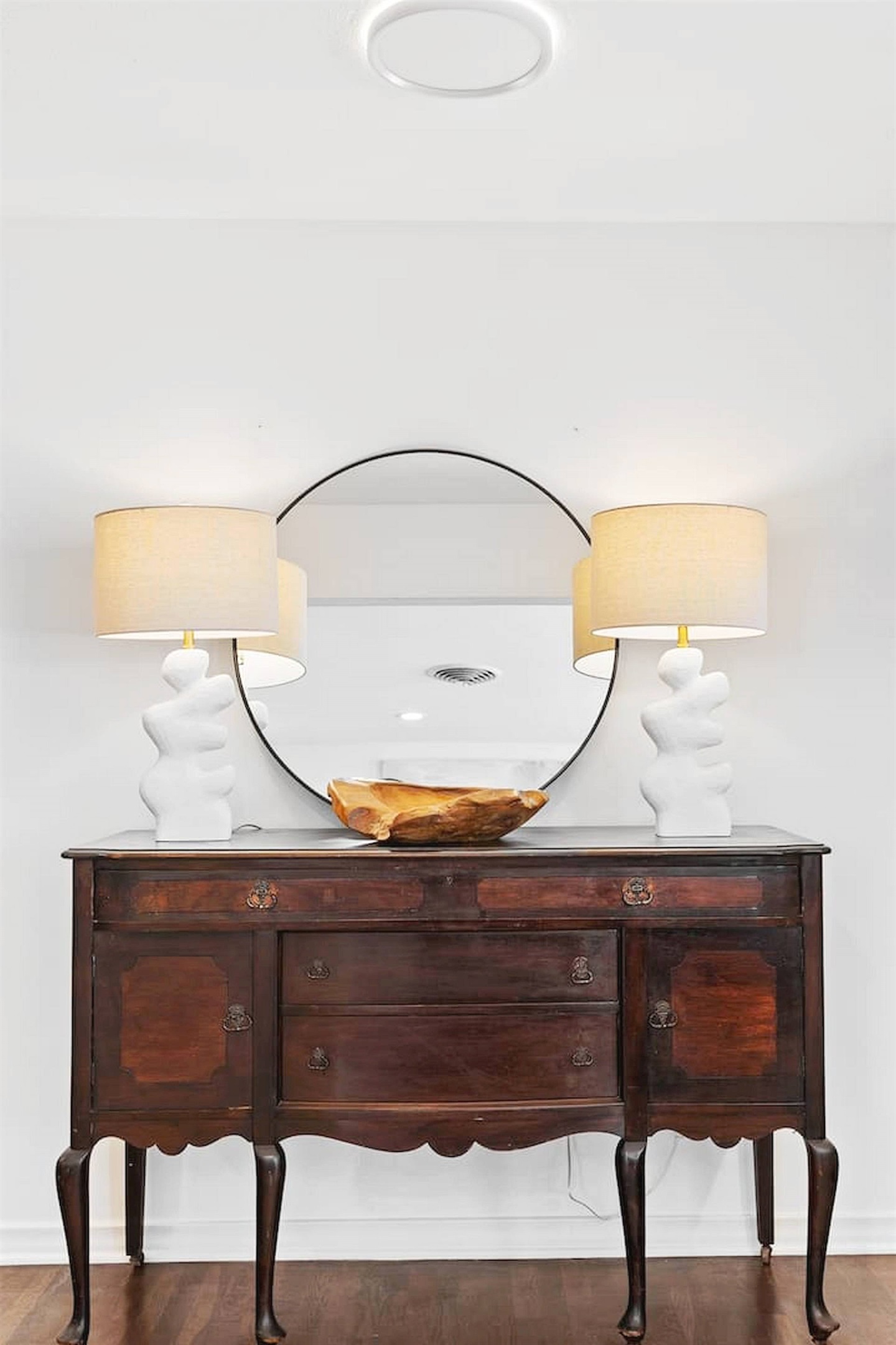 Thoughtfully styled accent space featuring warm wood tones, elegant lighting, and curated décor that adds charm and character throughout the home. ✨