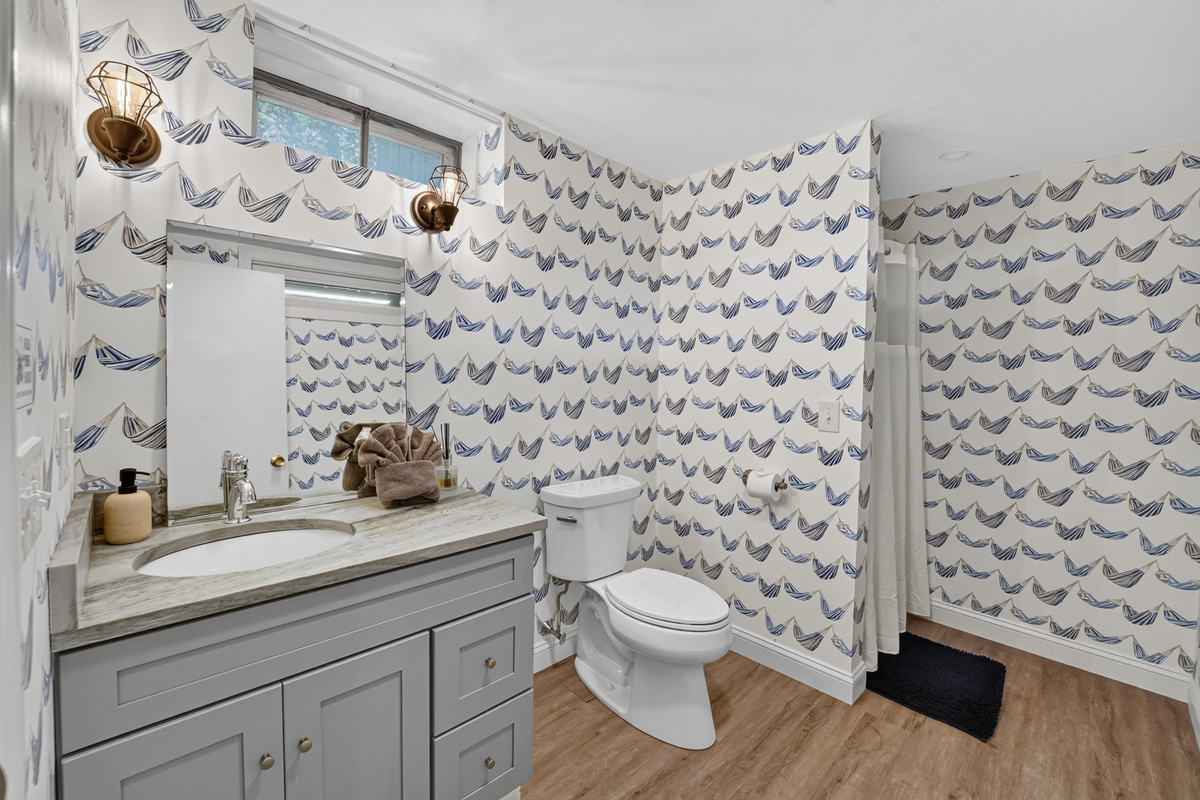 Convenient half bath located on the main level for guests.