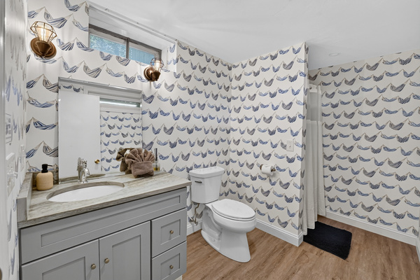 Convenient half bath located on the main level for guests.