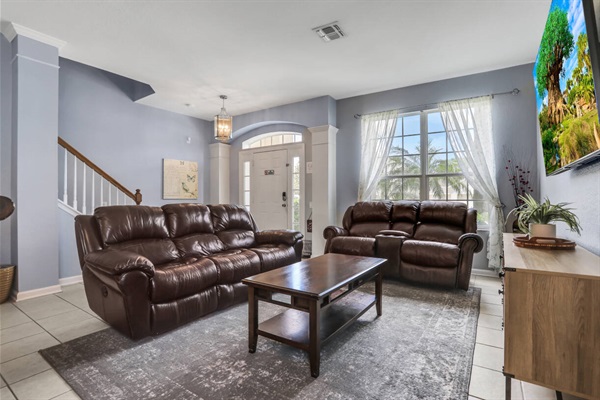 Entrance - Living room with smart TV and reclining seats