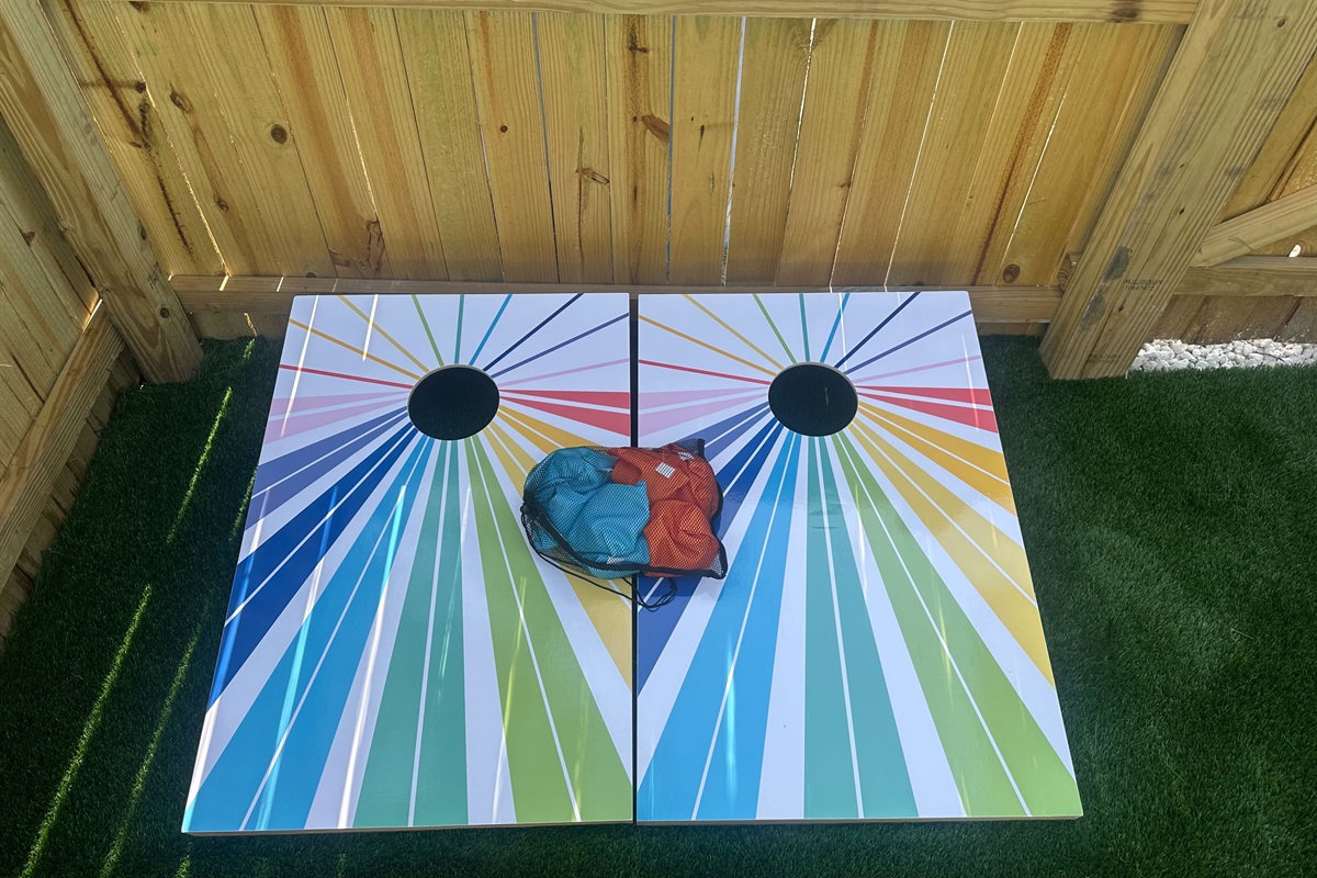 Add a splash of color to your day with our bold, custom-painted cornhole boards! This game set is ready to go and includes bean bags—great for casual tournaments or evening hangouts under the patio lights.