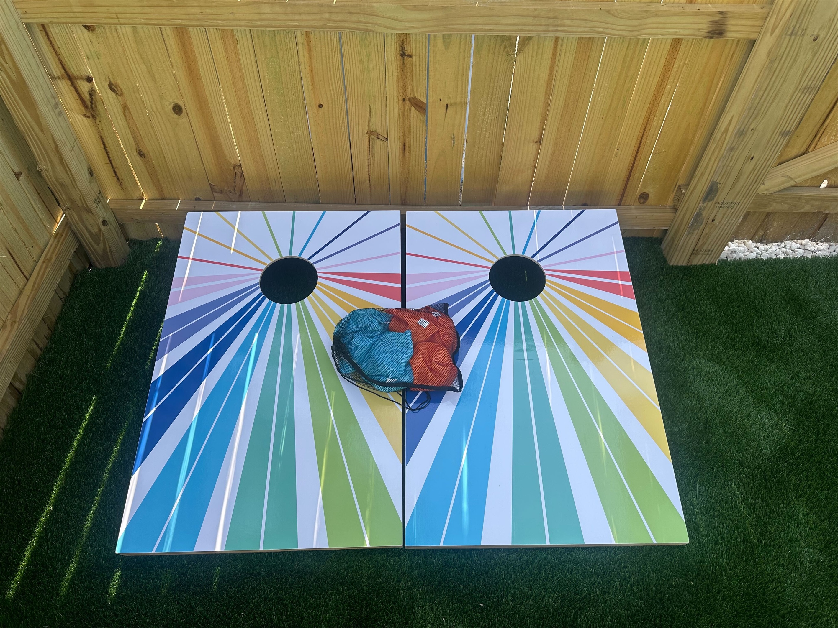 Add a splash of color to your day with our bold, custom-painted cornhole boards! This game set is ready to go and includes bean bags—great for casual tournaments or evening hangouts under the patio lights.