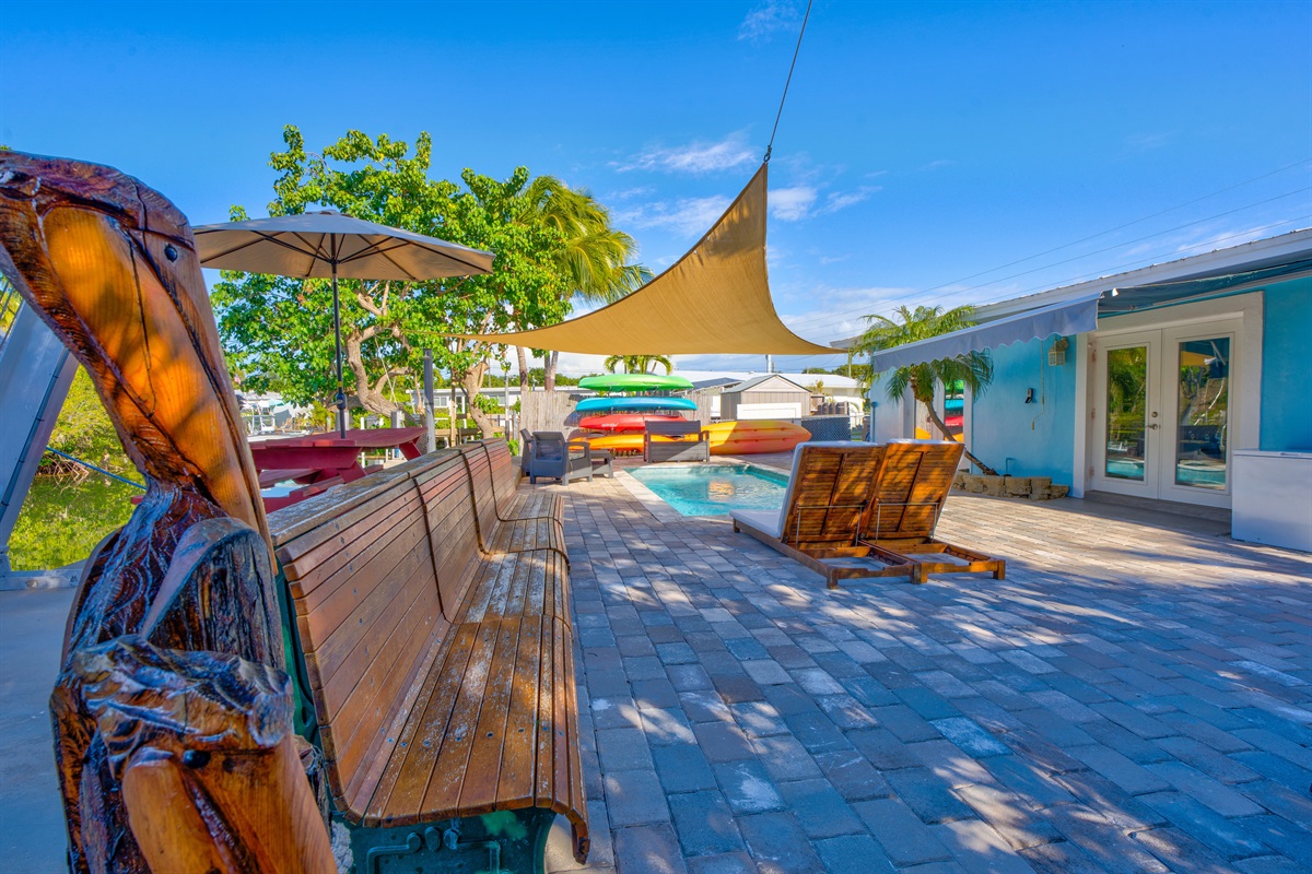 Plenty of seating for everyone, protected by shade from the mature tropical trees.