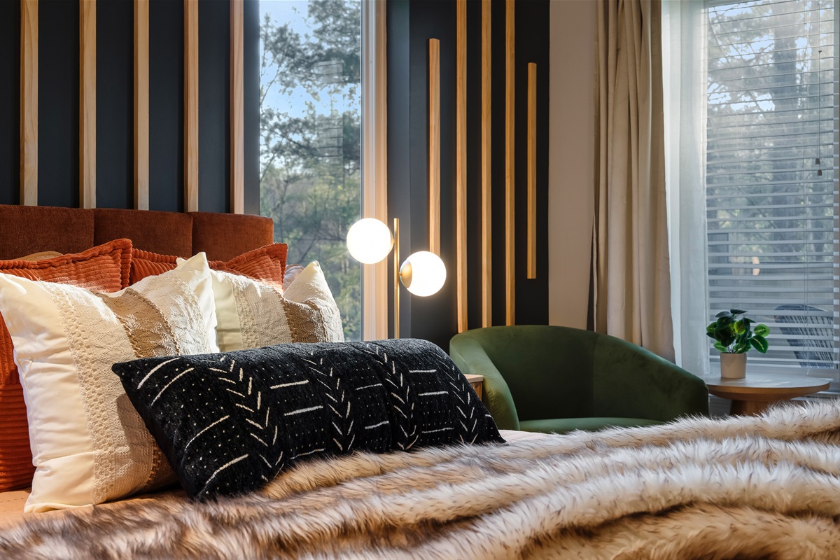 Cozy bedroom with warm tones and soft lighting - designed for a restful night after exploring Asheville