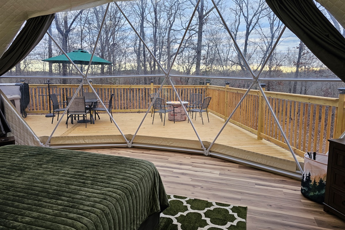 Wake up to the forest, just beyond your bed