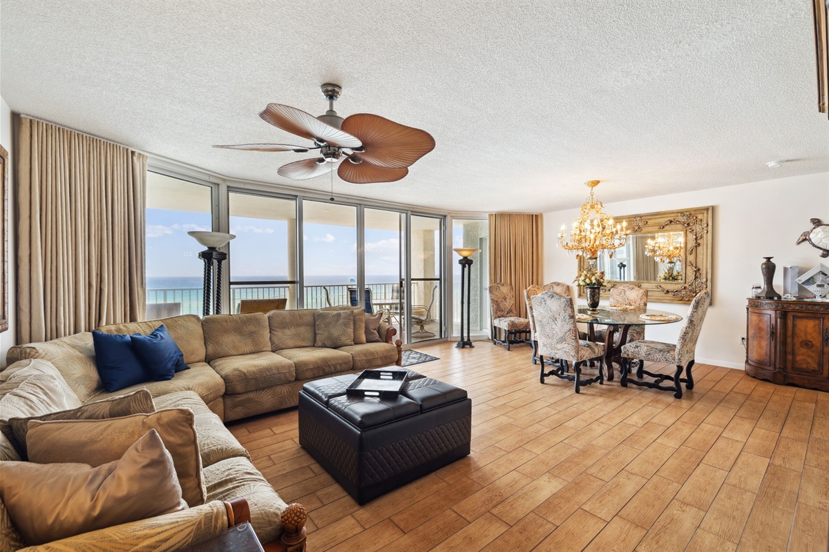 Enjoy panoramic views of the beach and balcony from the living room and dining area