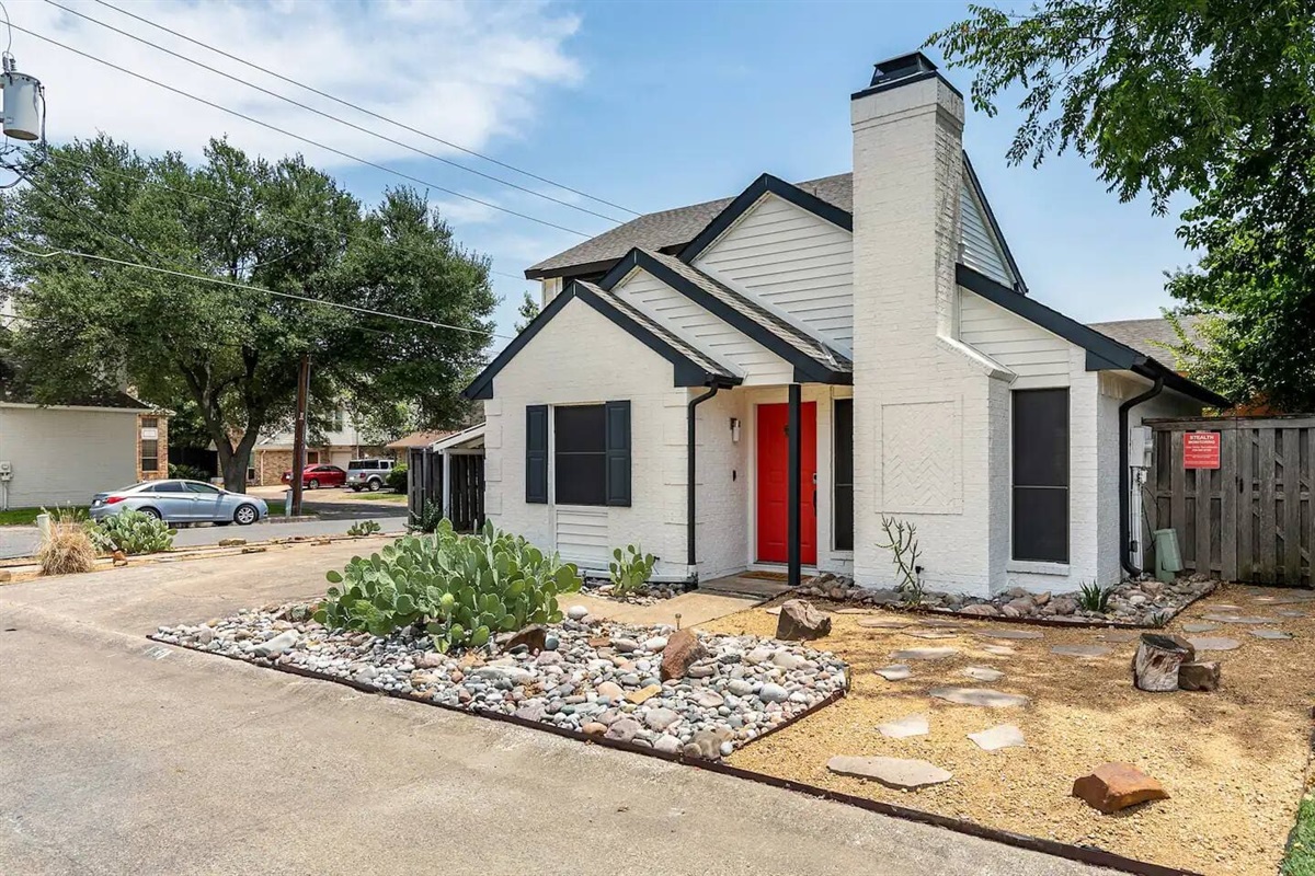 Exterior view with private driveway and charming curb appeal.