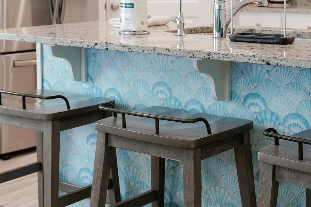 Fully stocked main kitchen with 3 bar stools