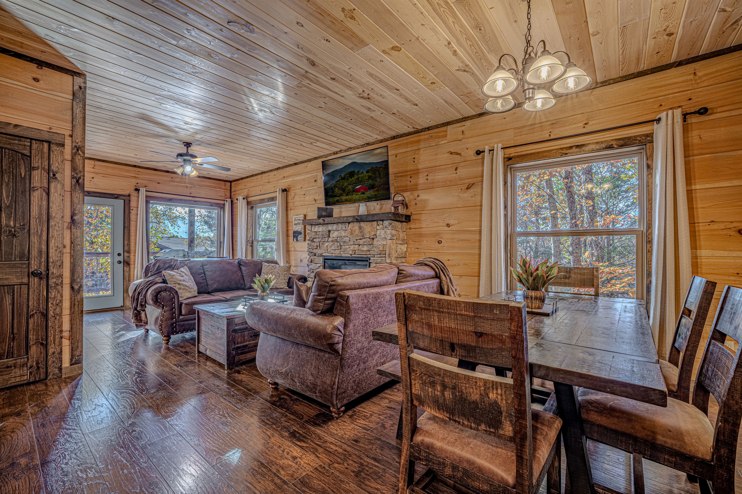 Spacious main living area with large windows and cozy cabin vibes.