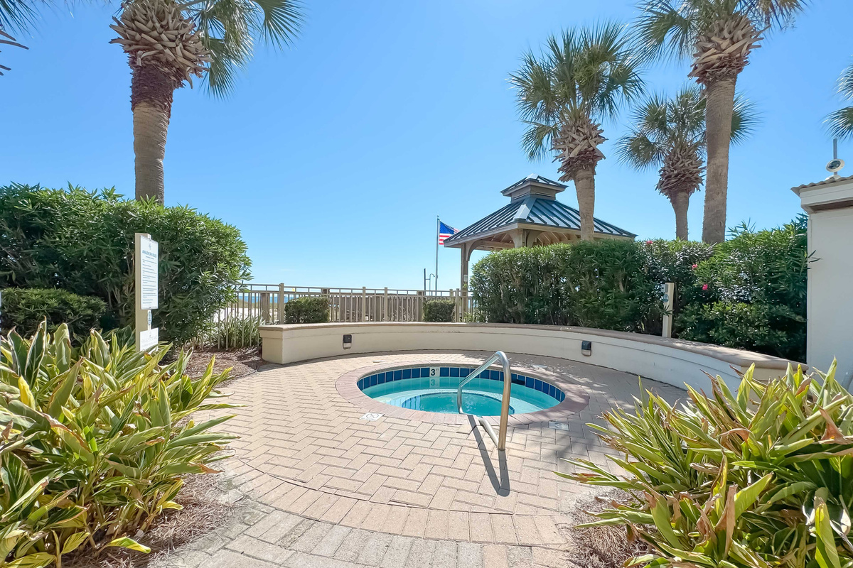 Enjoy access to premium amenities including this relaxing hot tub and sparkling pool, all within a beautifully landscaped setting.