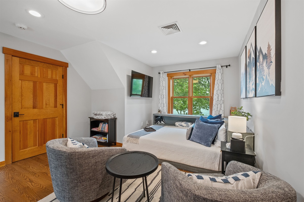Second floor loft bedroom with queen bed and bath just outside the door