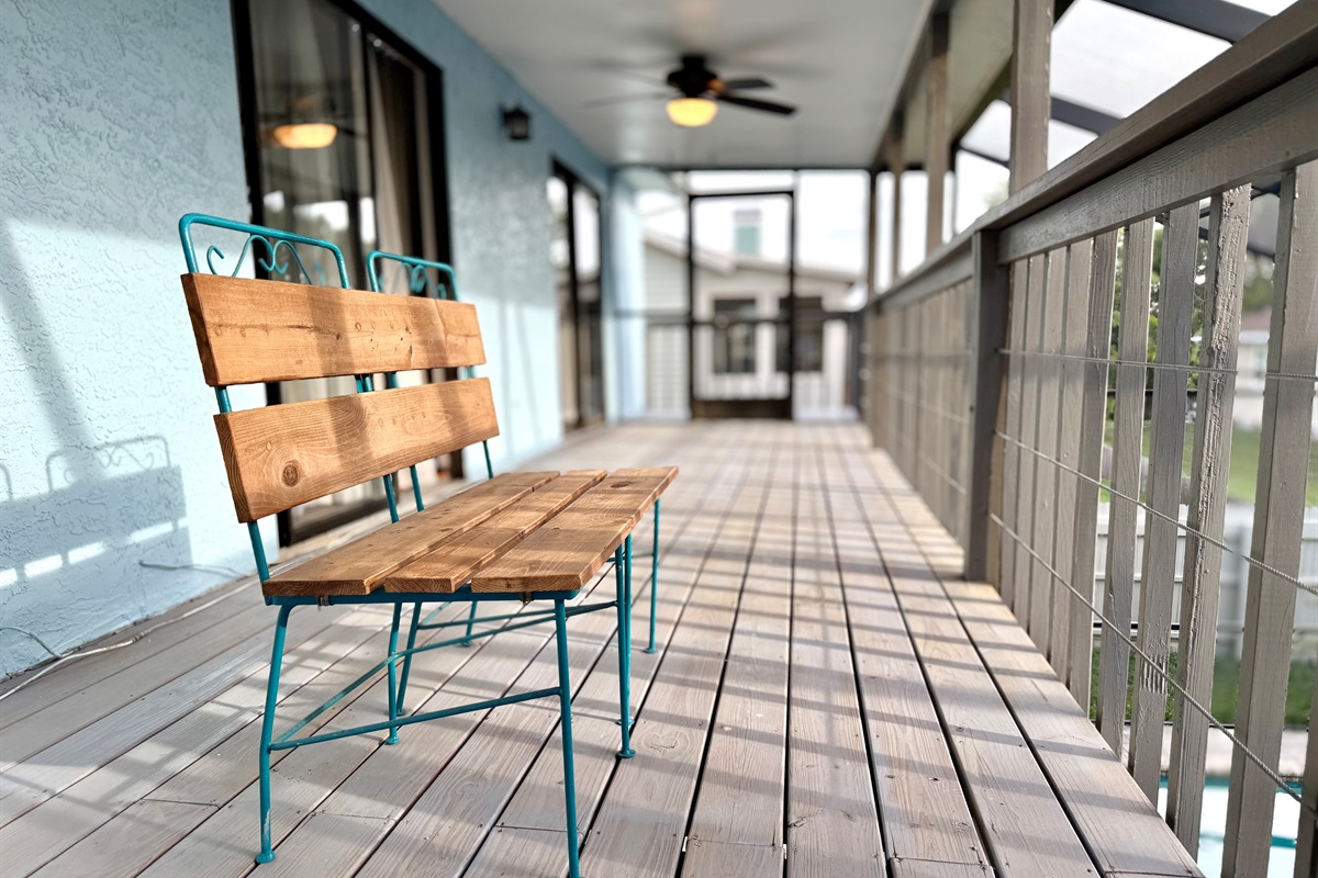 A pair of vintage-style metal and wood chairs offer a cozy space for conversation or quiet reflection.