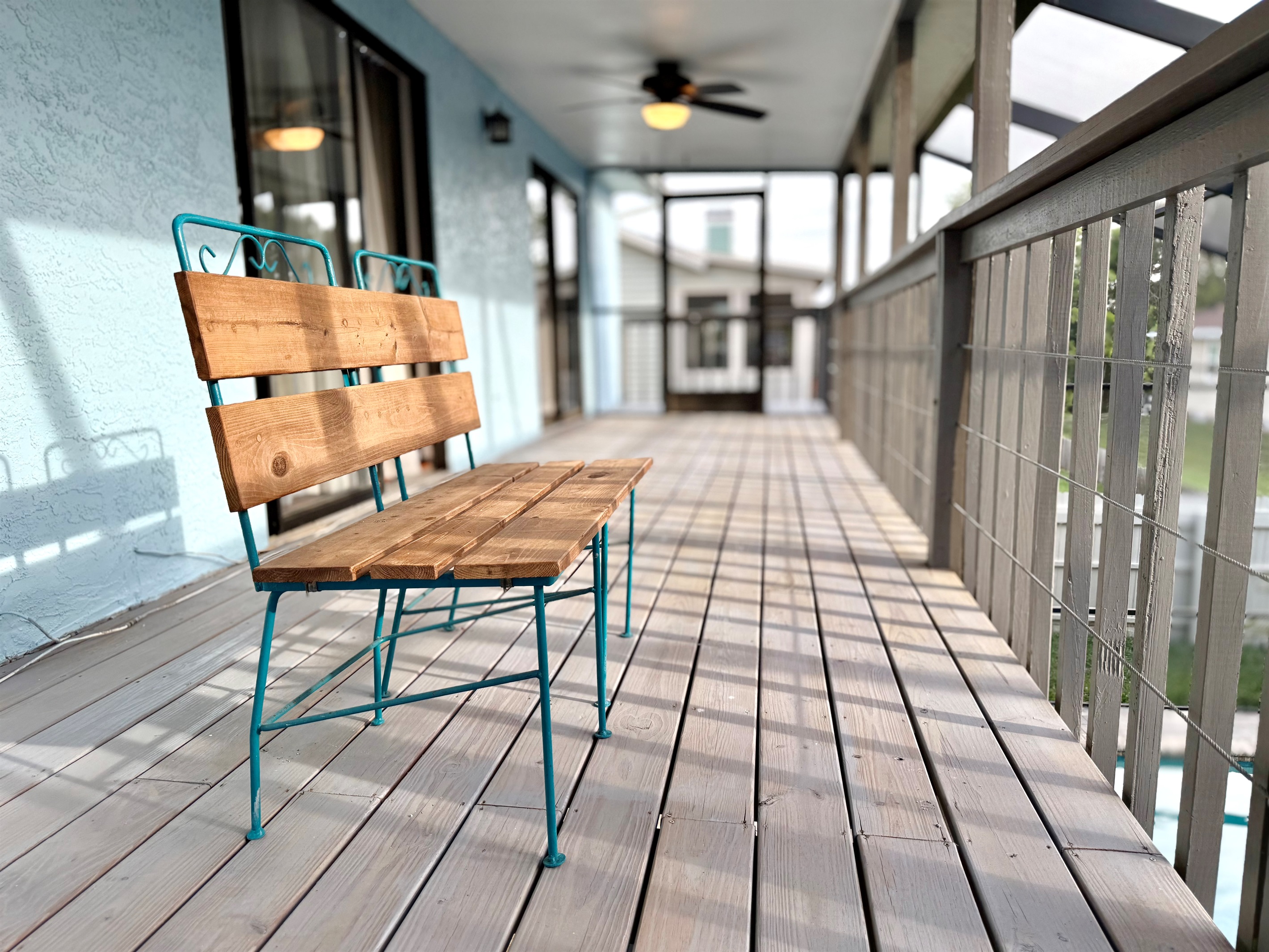 A pair of vintage-style metal and wood chairs offer a cozy space for conversation or quiet reflection.