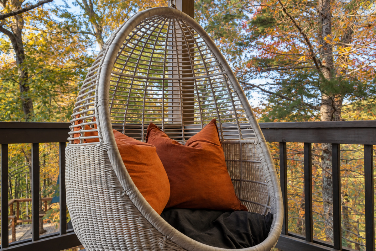 Swing into serenity... the egg chair cradles you in forest calm.