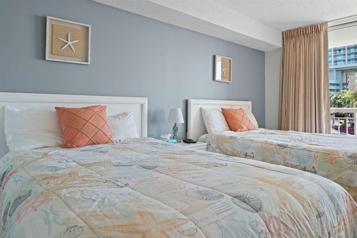 2nd Bedroom with double beds and balcony access