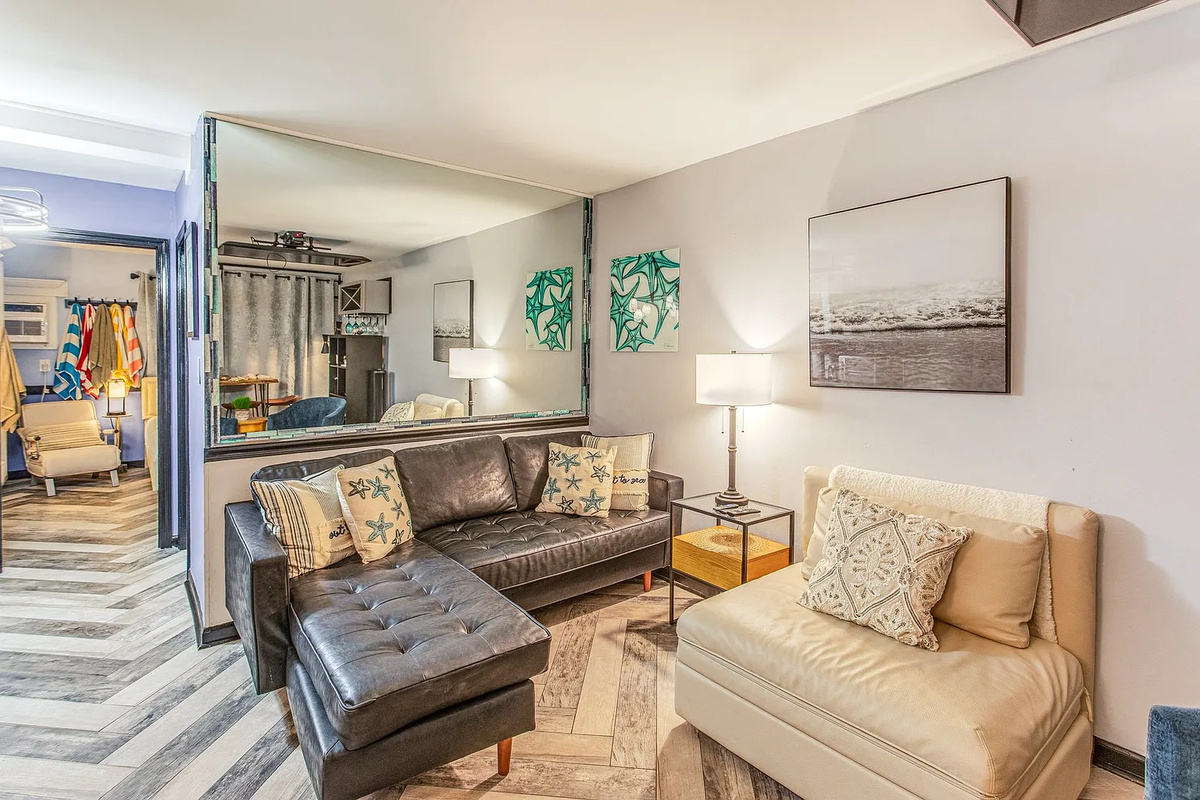 Living room area with large TV that will drop from the ceiling.