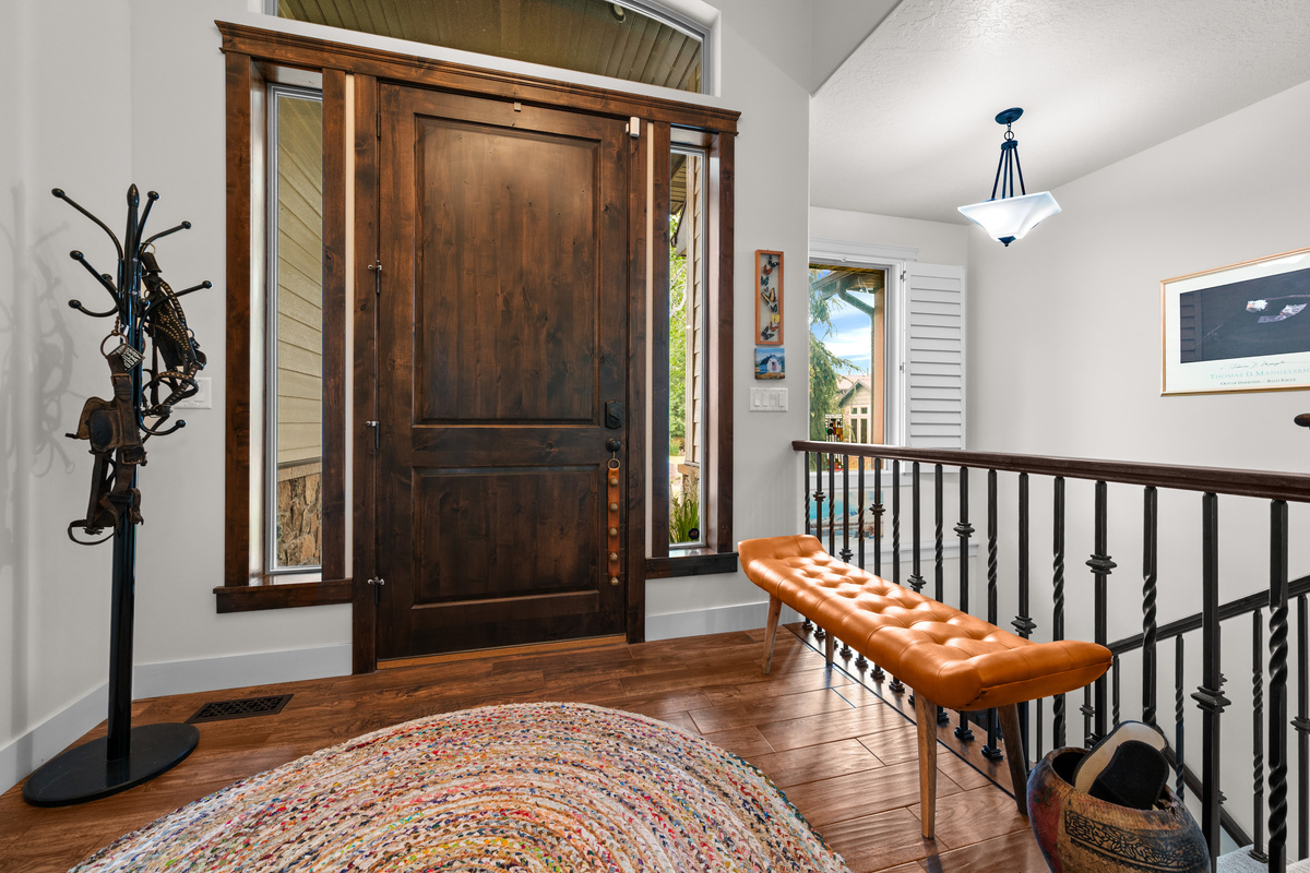 Warm and welcoming entry foyer featuring local artwork and elegant mountain-modern design.
