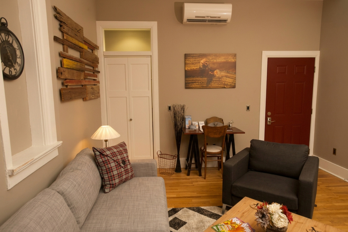 Skorda’s living area offers work area with closet door on the left and door to laundry and Plantera on the right