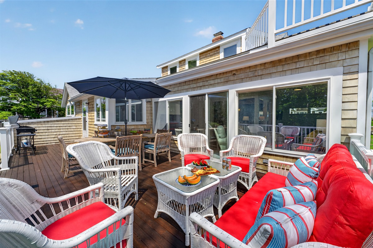 Comfortable outdoor furniture provides the perfect spot to relax and enjoy the fresh coastal air.