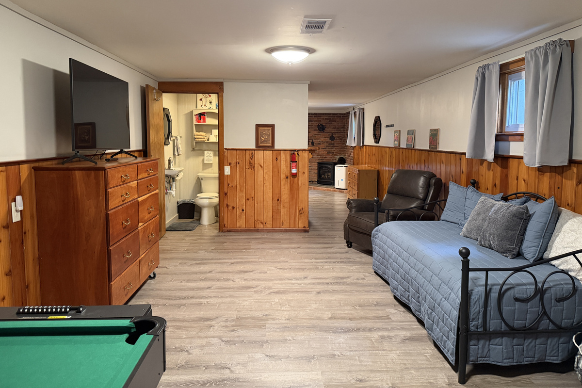 Lower level gameroom with mini pool table and SmartTV