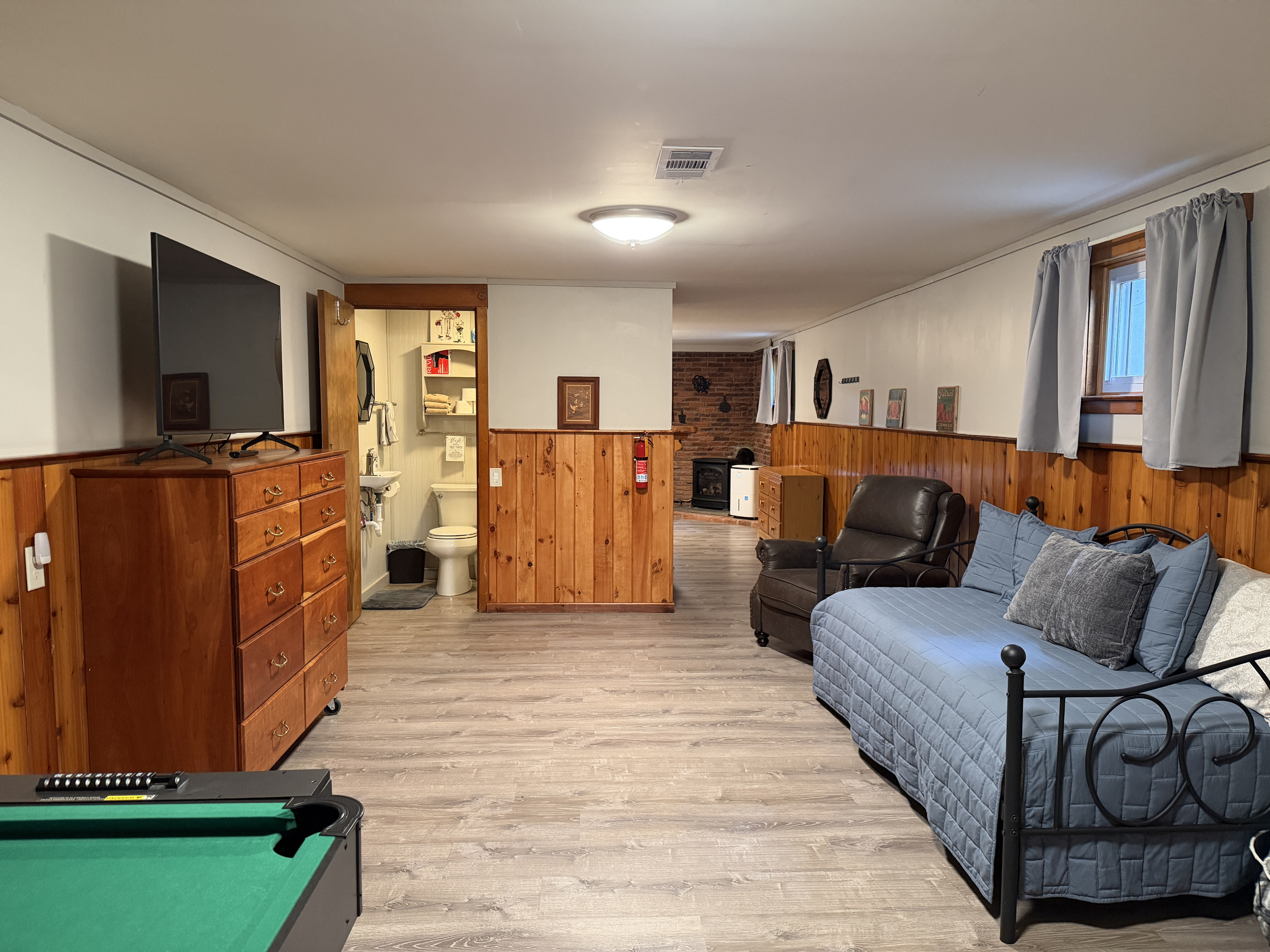 Lower level gameroom with mini pool table and SmartTV