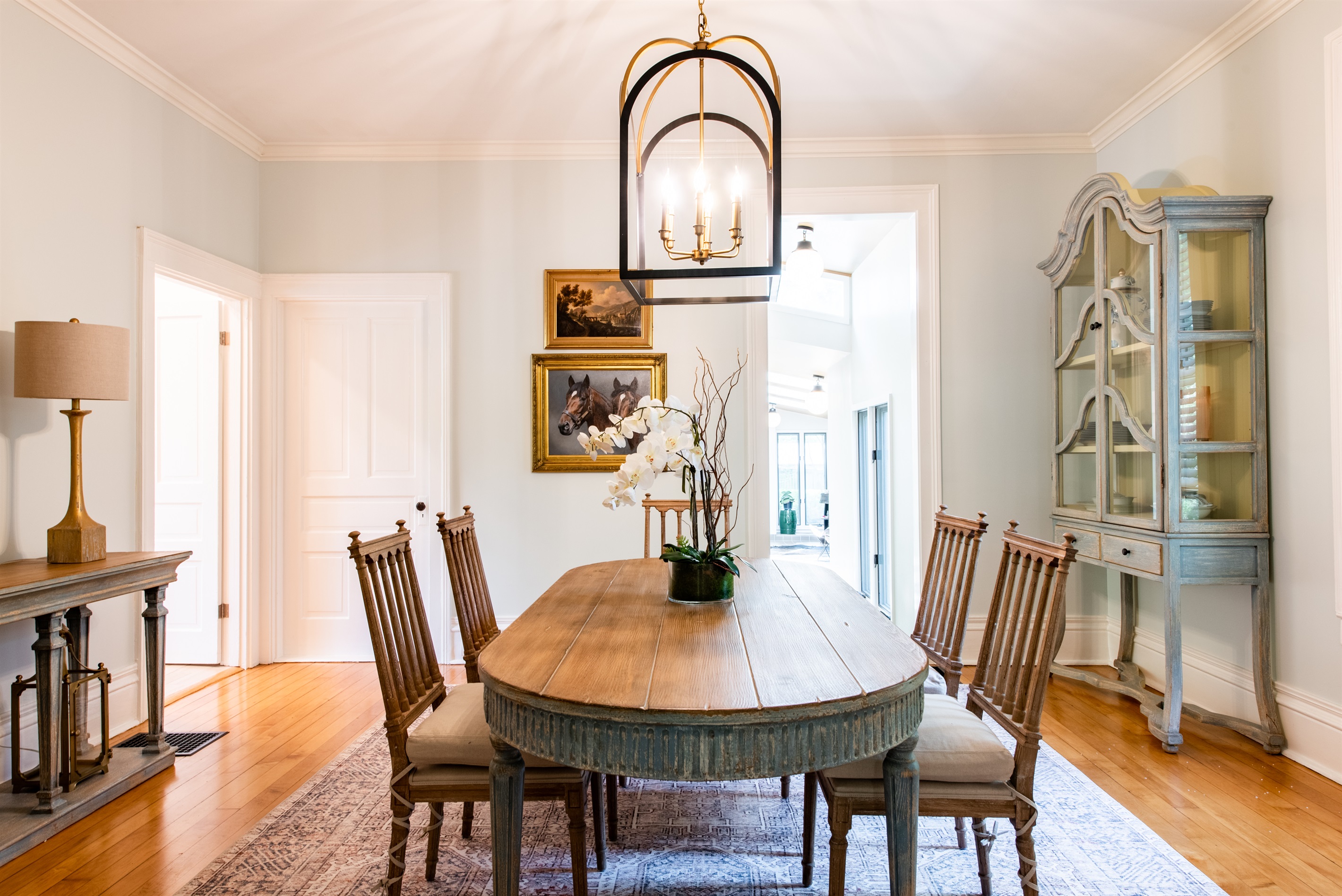 Spacious dining table, warm wood, cozy vibes—plenty of room for all!