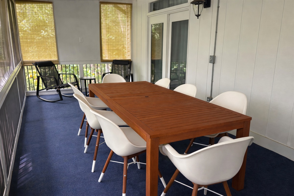 Enjoy morning coffee, family meals, or evening drinks on the large screened porch surrounded by nature.