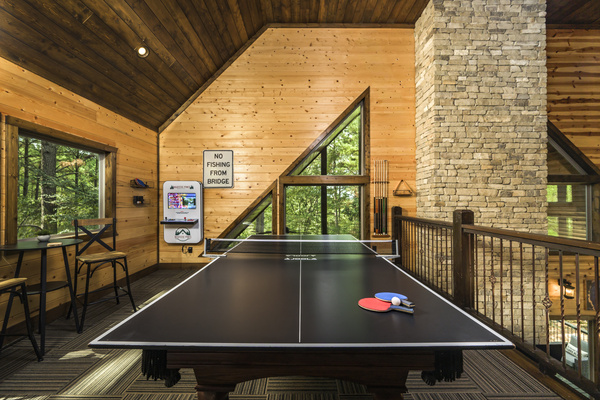 Enjoy cozy game nights and friendly competition around the pool table in your private cabin retreat.