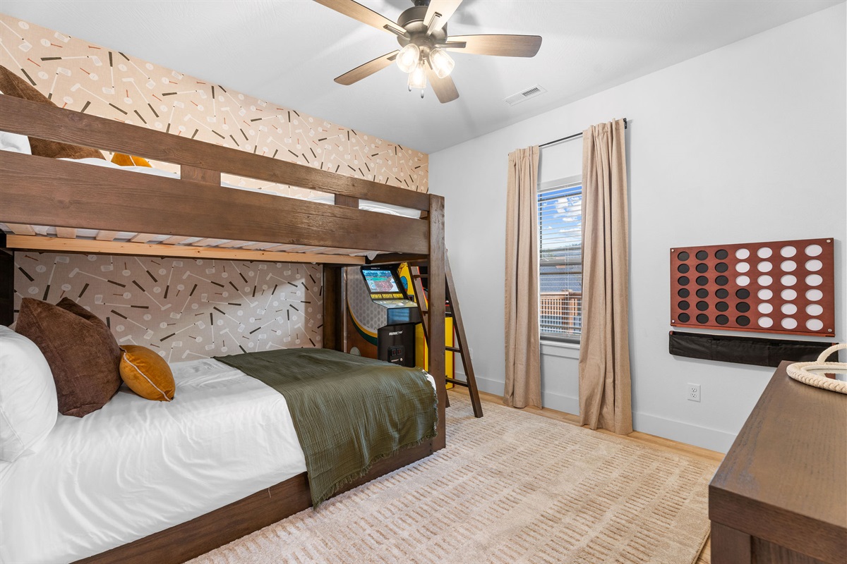 Thoughtfully set up bunk room with room to play and unwind.