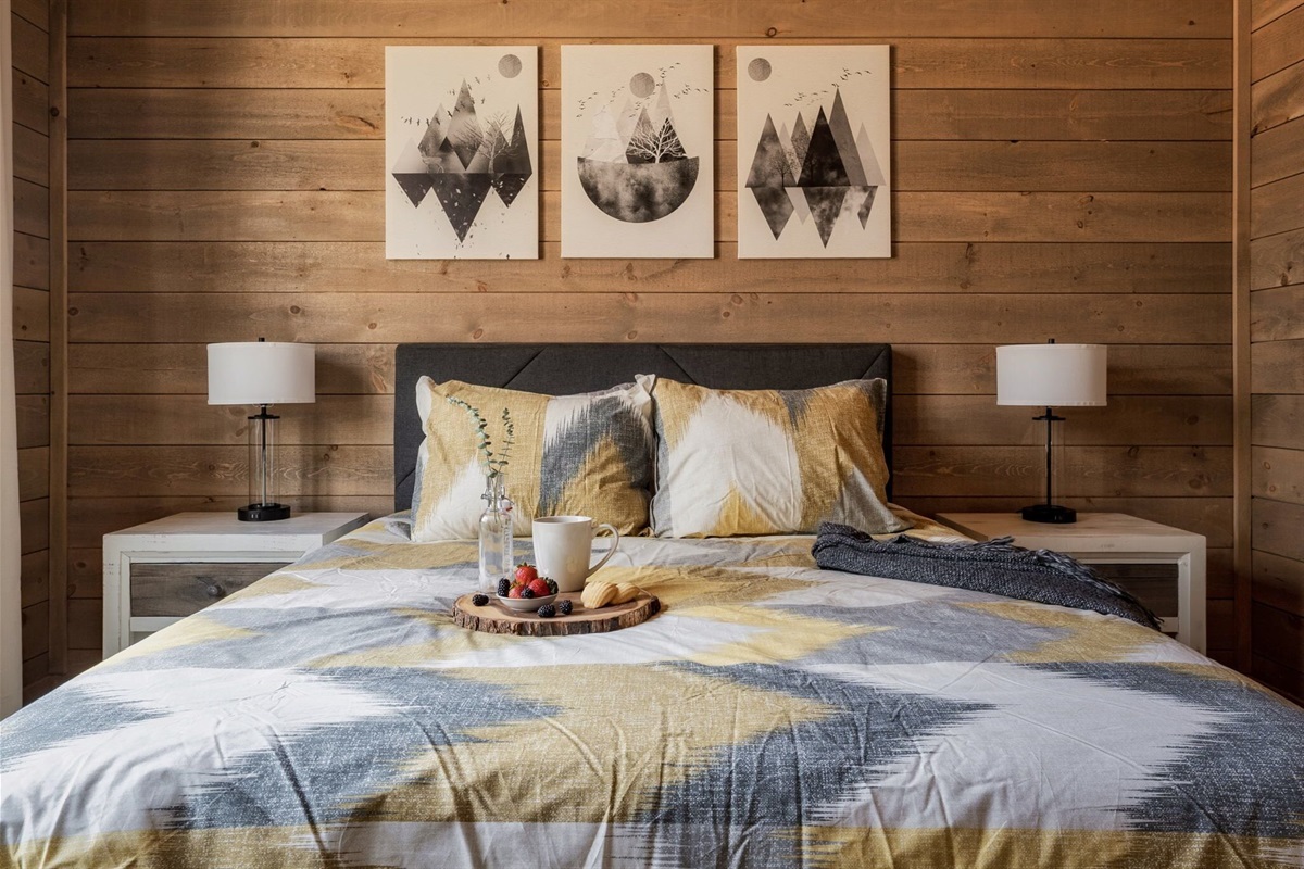 Every bedroom has lamps on either side and a huge ceiling fan above 