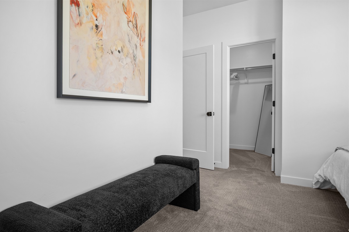 Spacious layout with a walk-in closet and seating area for added comfort.