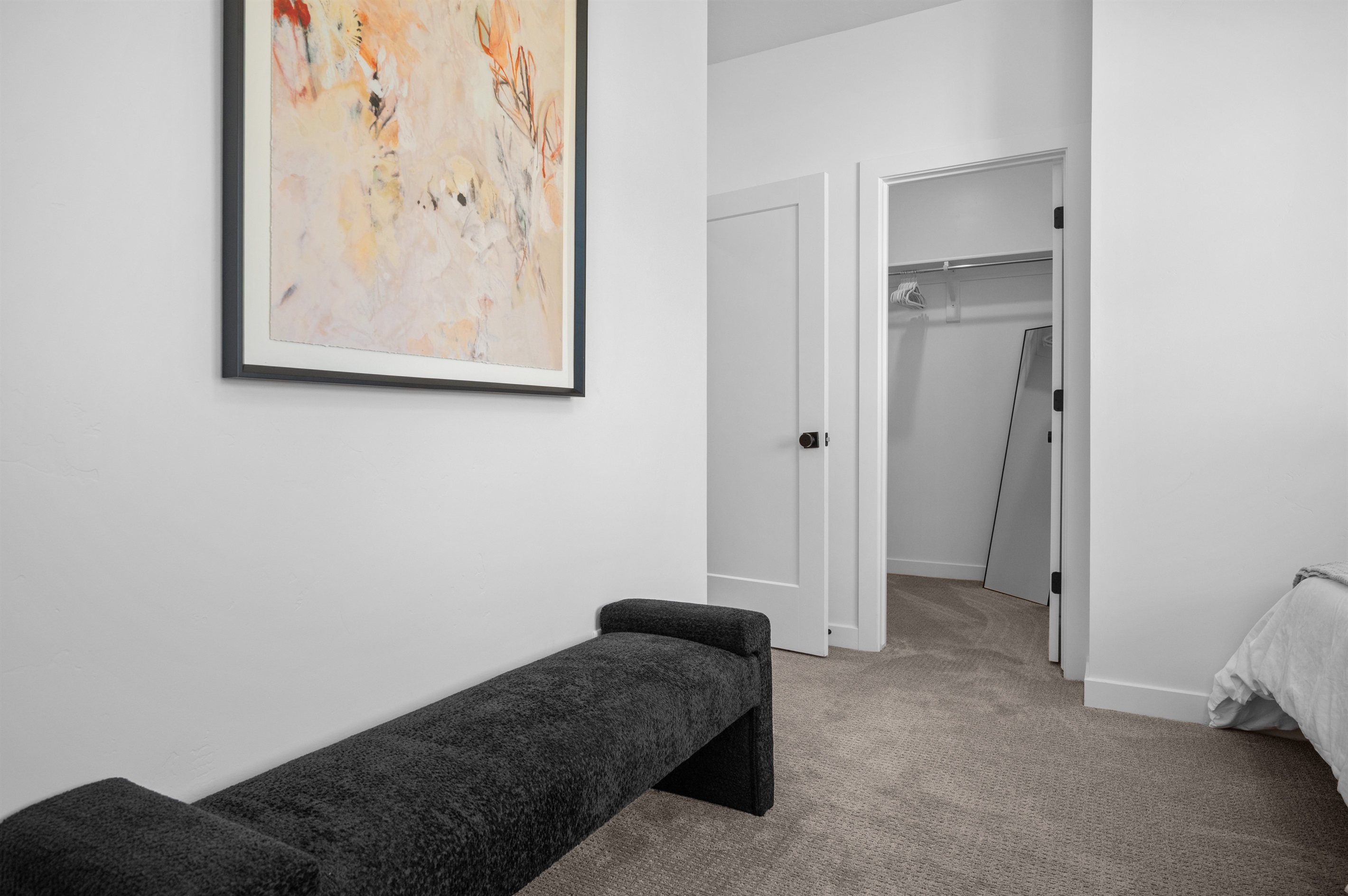 Spacious layout with a walk-in closet and seating area for added comfort.