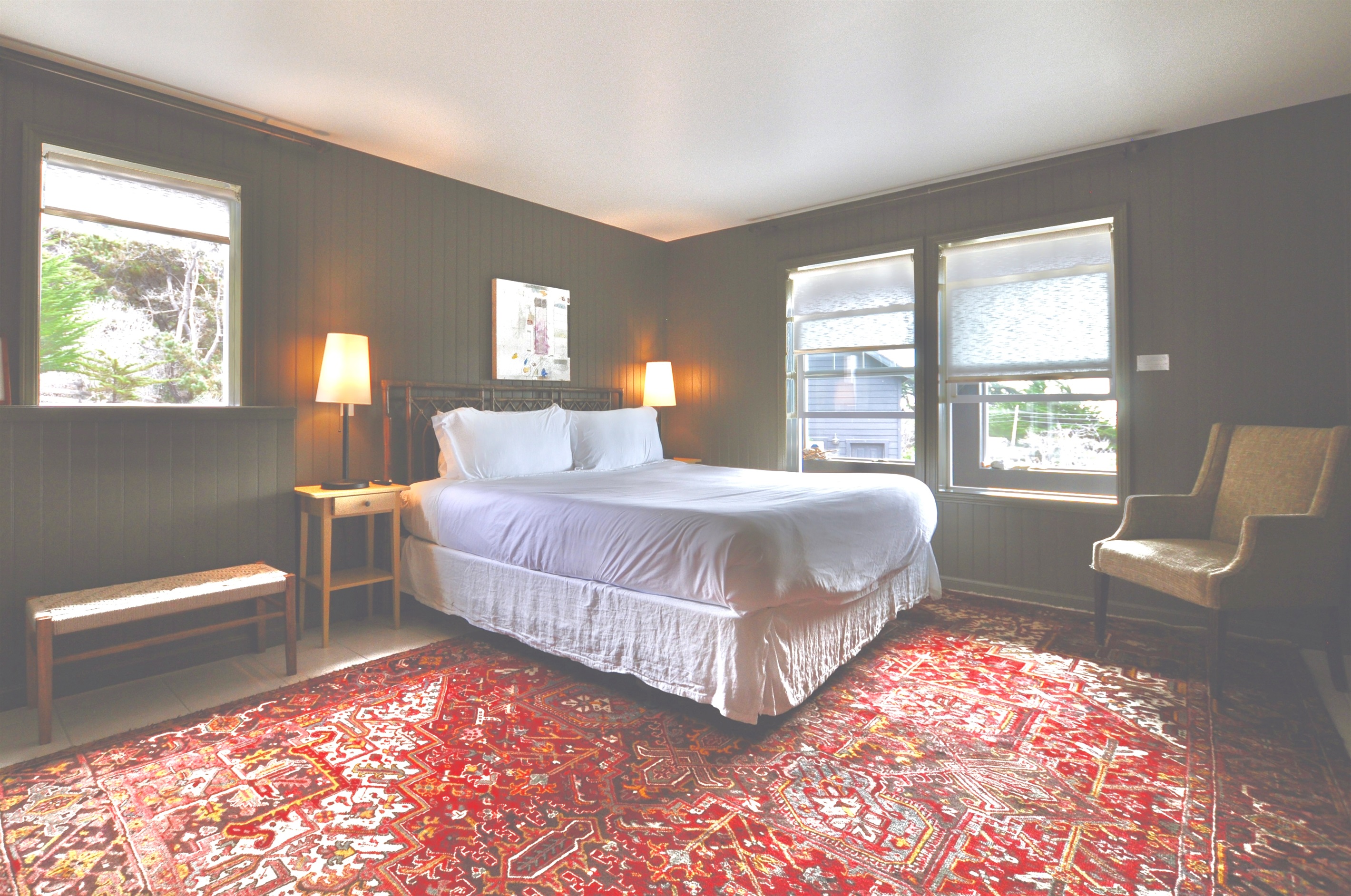 Downstairs bedroom: king bed, ocean views, smart TV, en suite bathroom with walk-in shower.