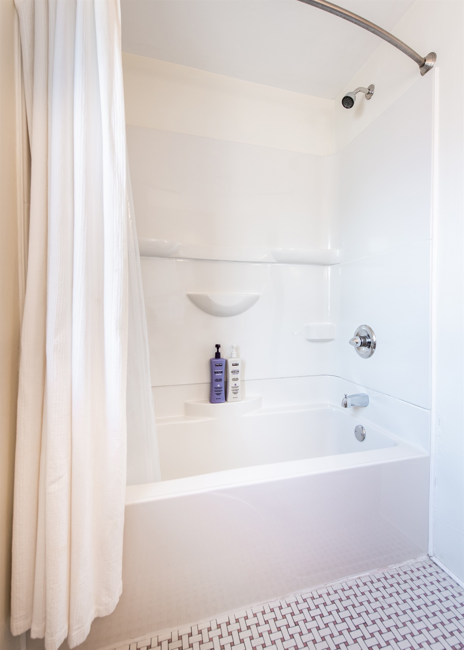 Full bathroom in hallway, tub/shower combo