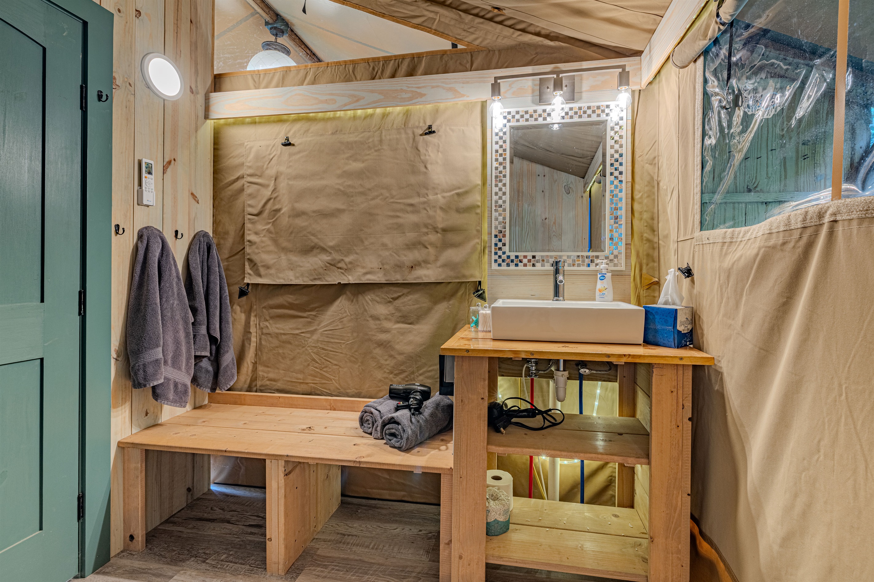 Every convenience, designed with style. From the rugged wooden accents to the stylish sink and mirror, we've created a luxurious interior where you can easily prepare for your day.