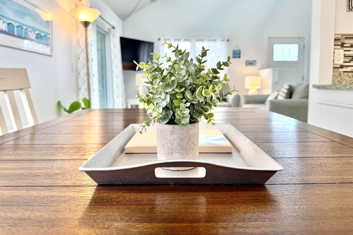 This charming dining space seats four and is the perfect spot for family meals or game nights.